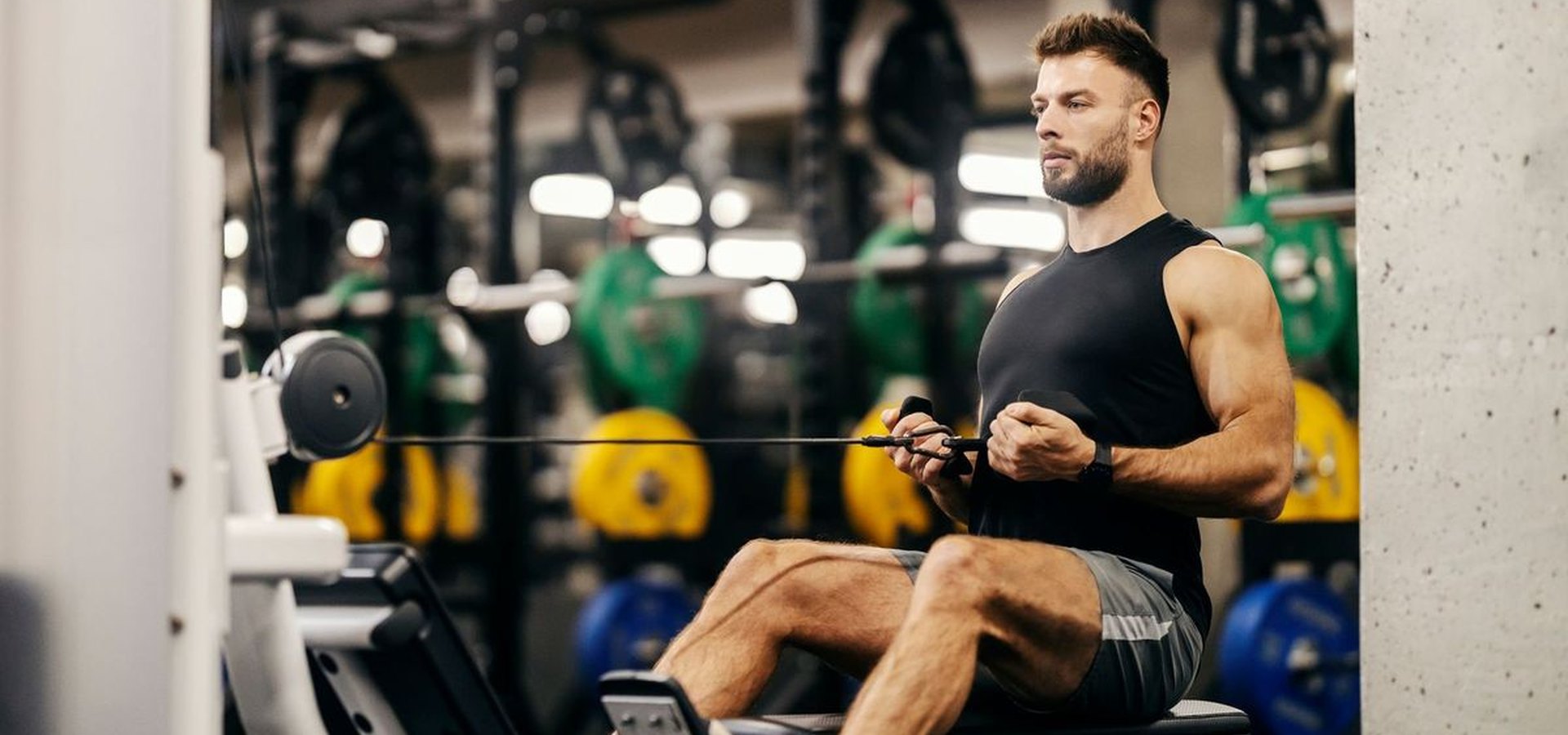 Athlete training on a seated cable row machine