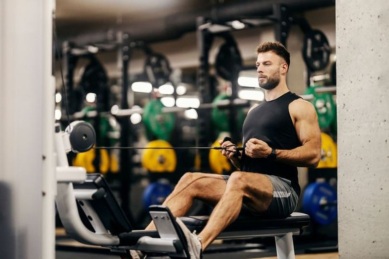 Member training on a seated cable row machine