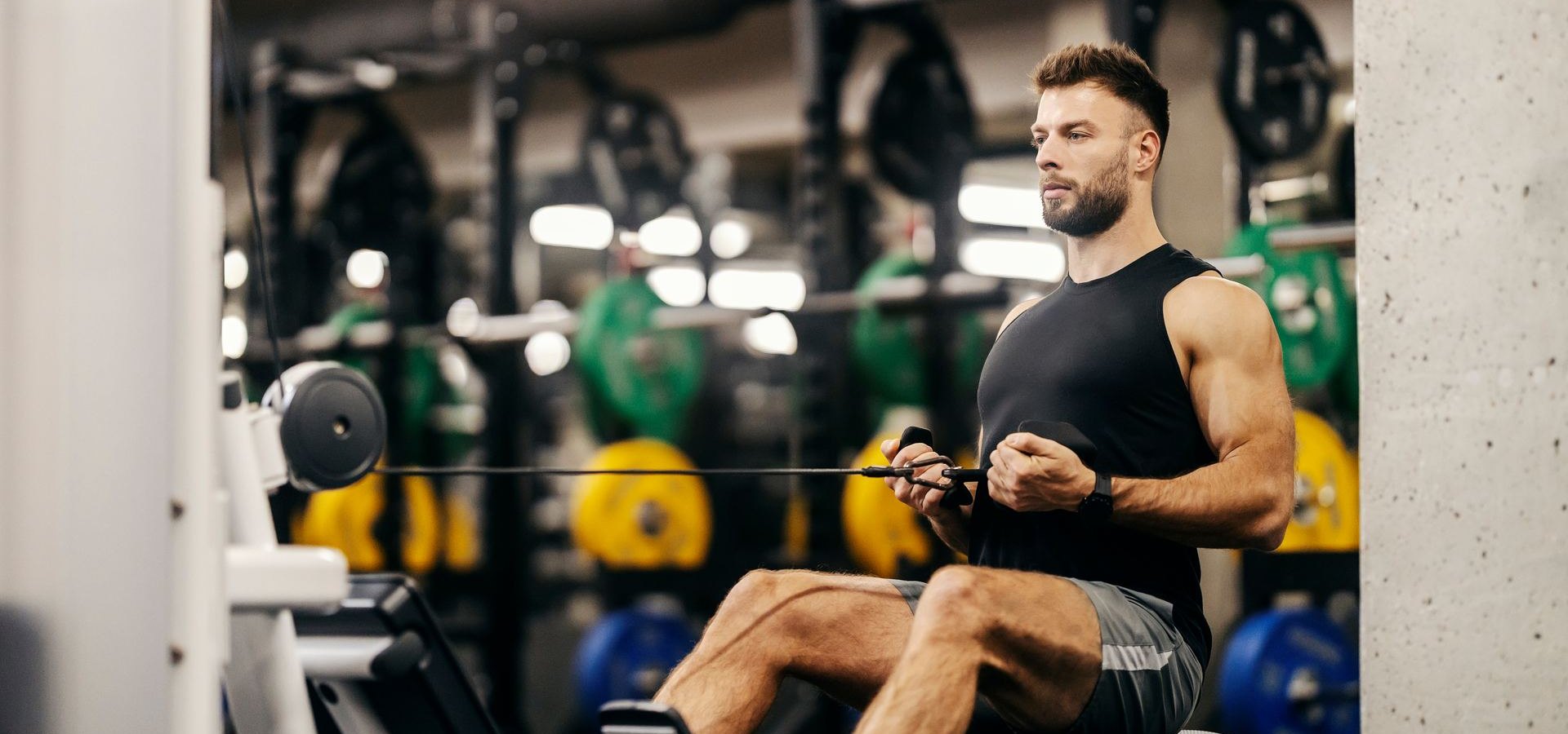 Athlete training on a cable row machine