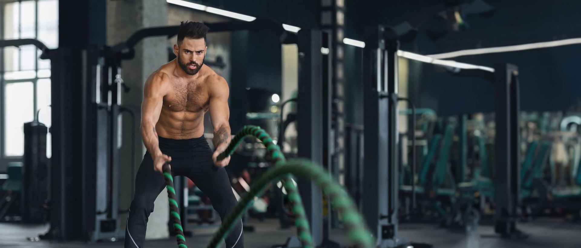 Athlete training with battle ropes